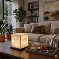 Custom 3D-printed lithophane cube light glowing in a living room